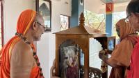 H.H. Swamiji garlanding the photo of Ishwaranand Giri Ji Maharaj  at Girirajeshwari Temple, Samvit Dham, Jodhpur